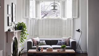 White tier on tier shutters in living room window
