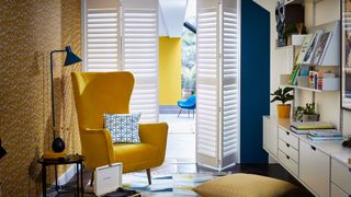 White tracked shutters in kitchen
