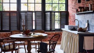 Grey cafe-style shutters in kitchen
