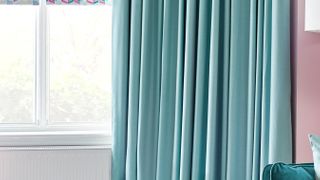 Harlow Turquoise curtains and Jazz Fuchsia roller blinds in living room