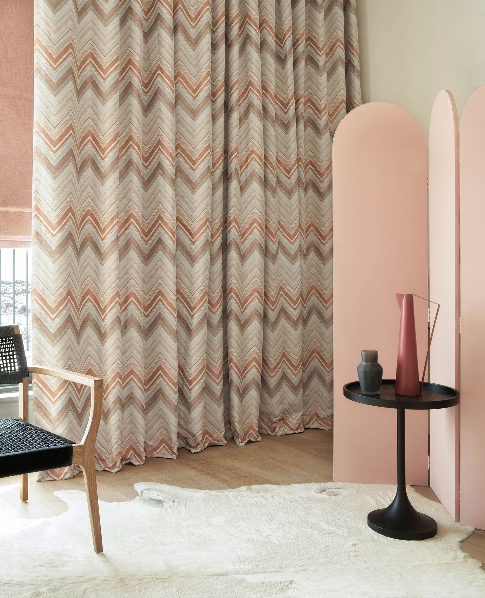 Art deco styled bedroom with chevron print curtains