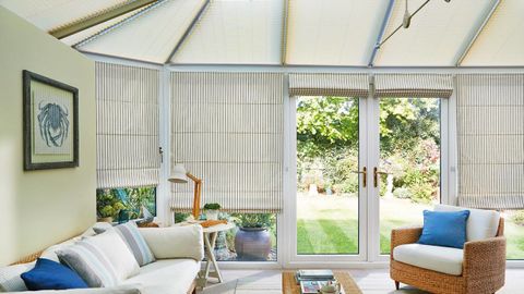 Roman side blind Downtown Blue with Elba Cream Pleated roof blind Conservatory
