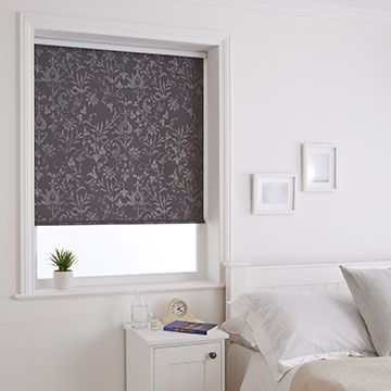 Grey damask-pattern Dulcie Anthracite roller blind hung in bedroom