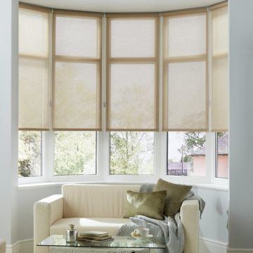 Plain light Tatum Beige roller blinds hung in living room