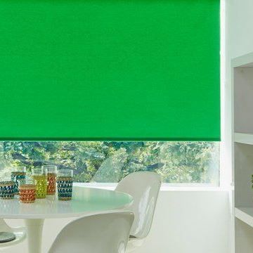 Green Roller Blinds in Acacia Emerald hung in kitchen