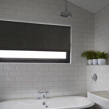 Waterproof roller blind in Iowa Black hung in bathroom