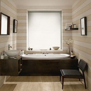 Light Portfolio Cream Venetian blinds in a cosy bathroom