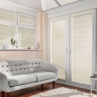 Portfolio Oatmeal Venetian blinds hanging in patio doors