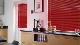 Red Portfolio Scarlet Venetian blinds hanging in a modern kitchen