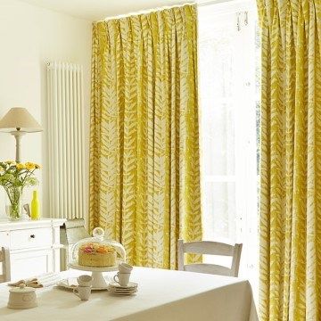 Dining room patio doors dressed with Isra Amber curtains