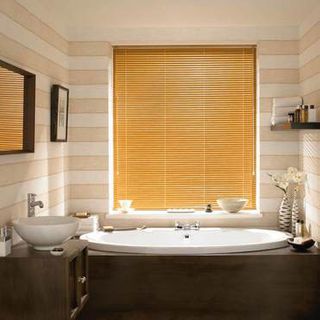 Aluwood Chestnut Venetian blinds hung in a cosy bathroom