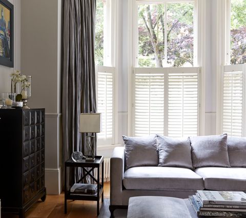 Living Room Window with Pure White Cafe Style Shutters paired with Erika Charcoal Curtains
