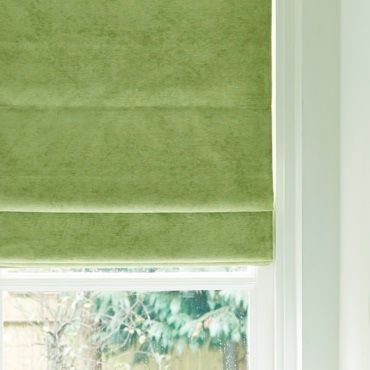 light green roman blinds close up