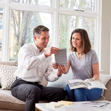 hillarys advisor showing product samples to a customer in her home
