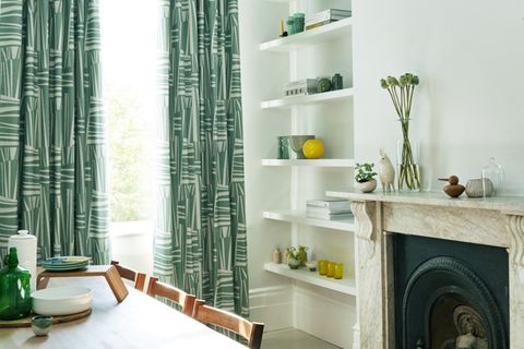 Green and white modern curtains in a dining room