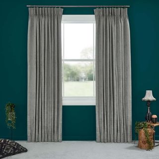 Abigail Ahern Cley Donkey Curtains set against dark teal walls