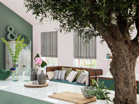 A kitchen diner with Anouk Dusk Roman blinds