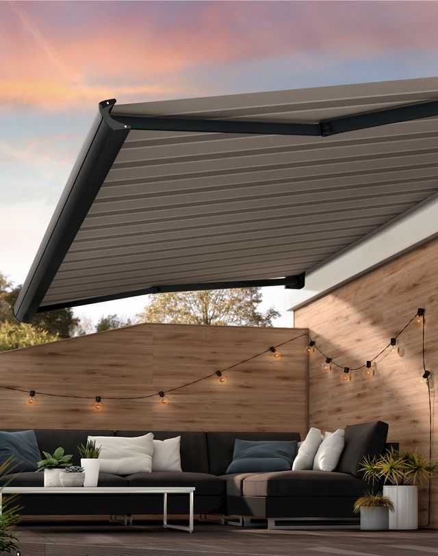 Evening patio with roma manosoque dark grey awning