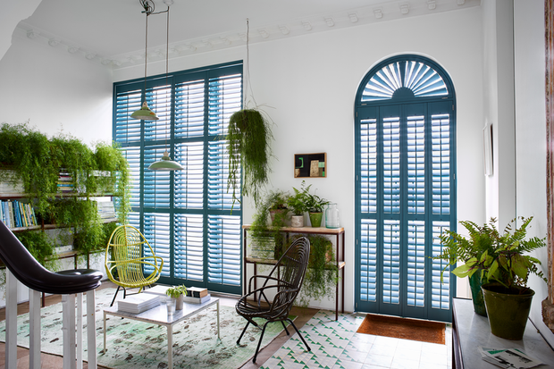 Blue custom colour shaped shutters in hallway