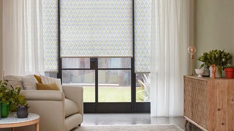 Crystal Ecru Voile curtains and Petula Olive curtains in living room