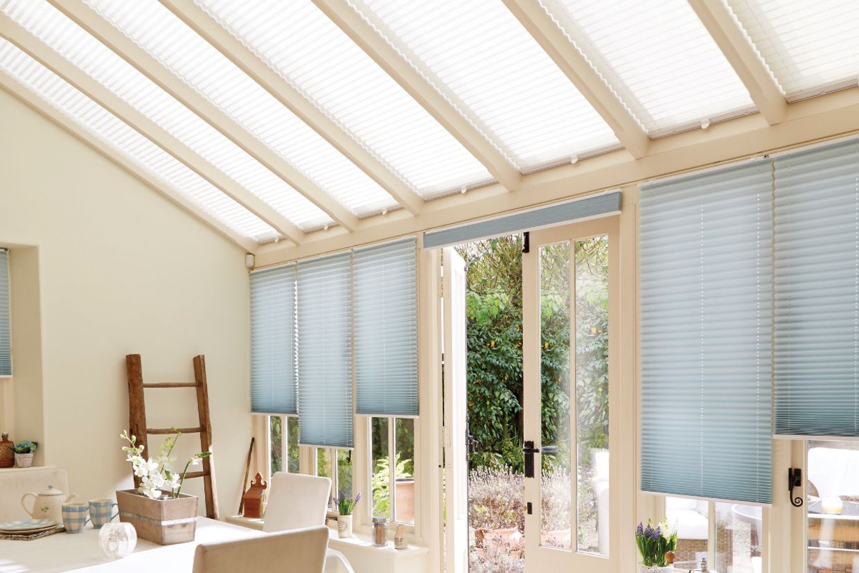 conservatory with grenoble cream pleated roof blinds