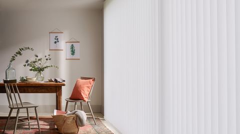 Modern rustic dining room with full length white vertical blinds