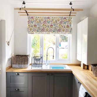 floral print on white roman blind in kitchen