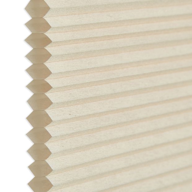 Side view showing honeycomb in Cream swatch for pleated blinds