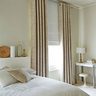 Beige Eyelet Curtains with a White Roman Blind in the bedroom - Bamboo Linen Curtains and Mineral Chalk Roman Blind