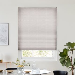 natural cream shade pleated blind dressed on window