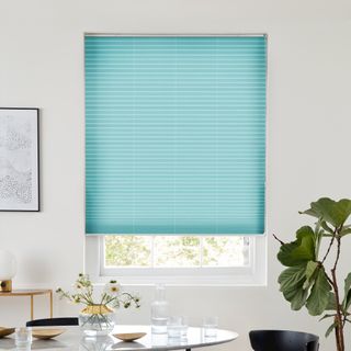 light turquoise blue pleated blind dressed on window