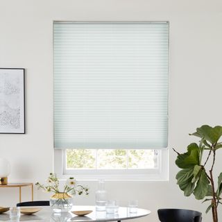 White pleated blind dressed on window
