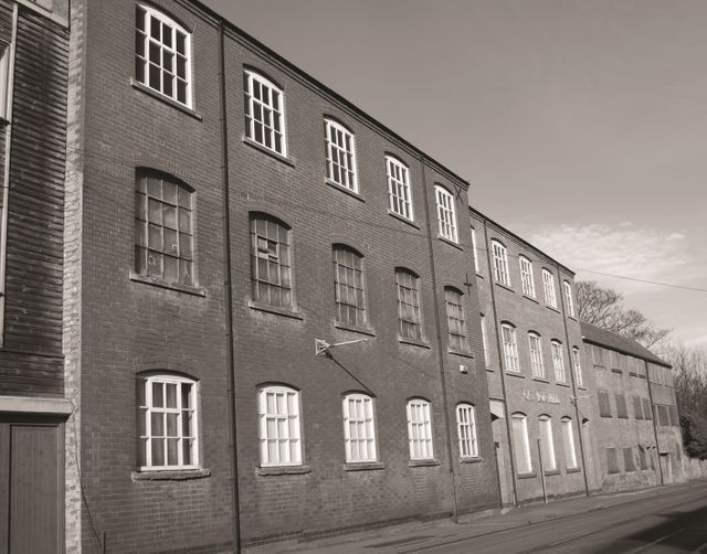 an old black and white image of the Carlton Mill on Burton Road in Nottingham