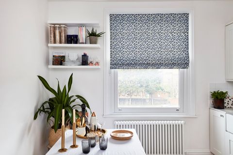 Blue patterned roman blind in kitchen