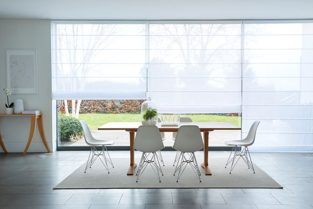 Clarity white Voile roman blinds in large wide dining room window