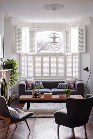 White tier on tier shutters in a modern living room