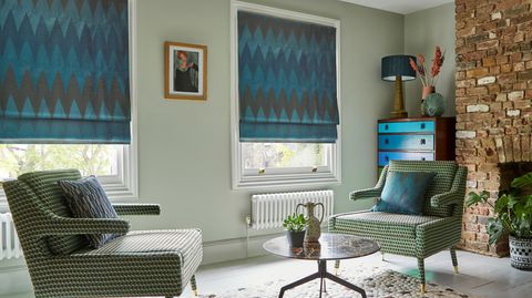 Zaha Deep Teal Roman blind in a lounge window