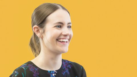 Sophie the Hillarys HR partner smiling whilst holding a notepad