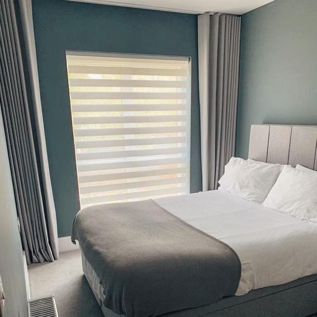 Daybreak cream day and night blinds in minimalist bedroom