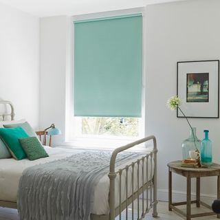 Duck egg blue Burma Eau De Nil roller blind hung in bedroom