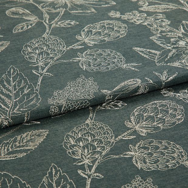A folded piece of fabric with Anika Grey printed on it