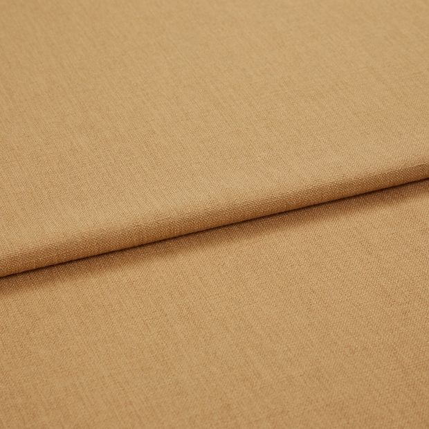A folded piece of fabric with Bailey Sand  printed on it