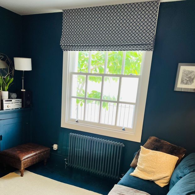 Eclipse denim patterned roman blind in cosy living room