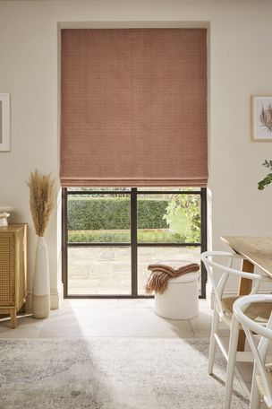 Wave blush roman blinds on crittal window