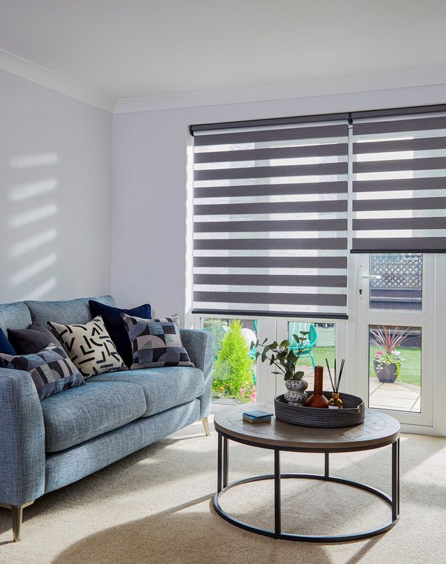 Dark grey day and night blinds on french doors in living room
