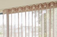 close up of pink wave header style voile curtains