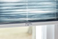 close up of blue pleated blinds with tab control