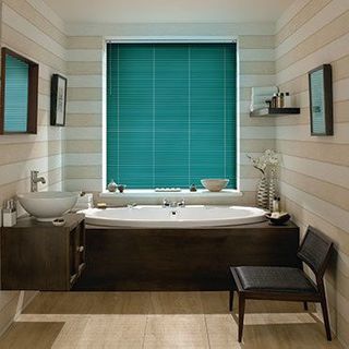 Green Portfolio Deep Ivy Venetian blinds in a cosy bathroom