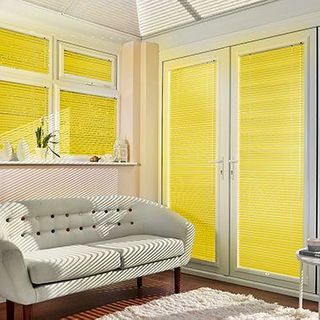 Yellow Portfolio Marigold Venetian blinds hanging in patio doors