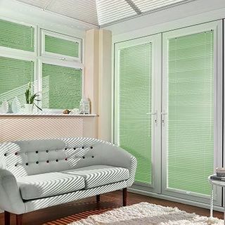 Green Portfolio Pistachio Venetian blinds hanging in patio doors